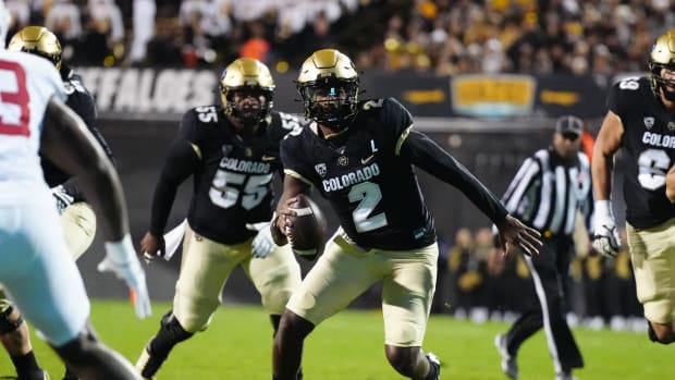 Colorado Buffaloes quarterback Shedeur Sanders (2) scrambles with the ball in the first quarter against the Stanford Cardinal at Folsom Field